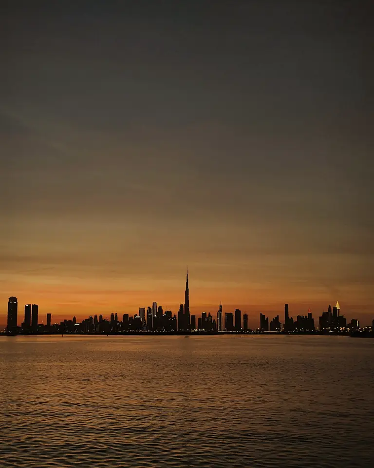 Dubai at dusk across the water, home spa service for Jumeirah