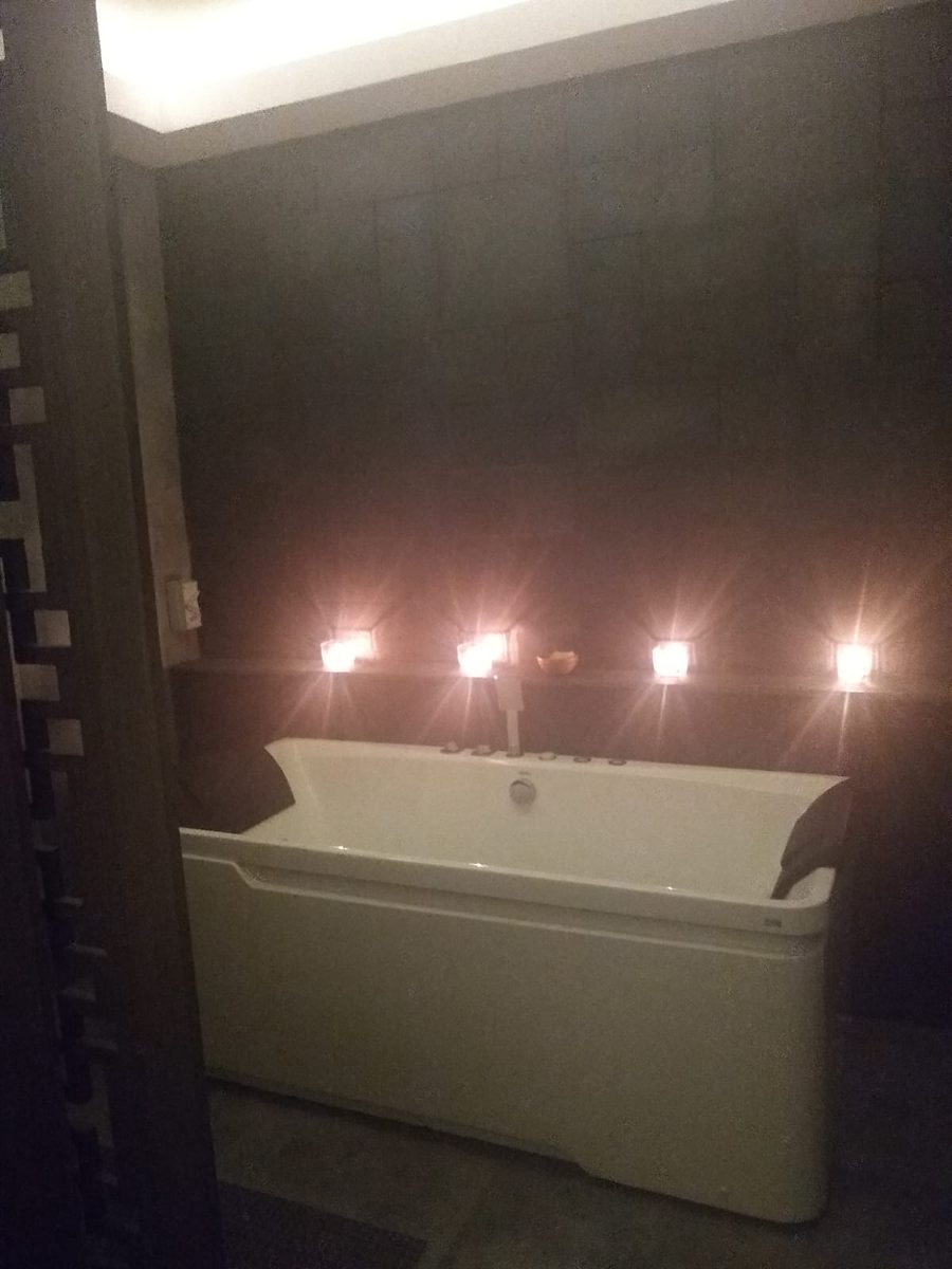 The hydrotherapy room with a candle-lit bubble-jet bath at the Al Garhoud spa centre
